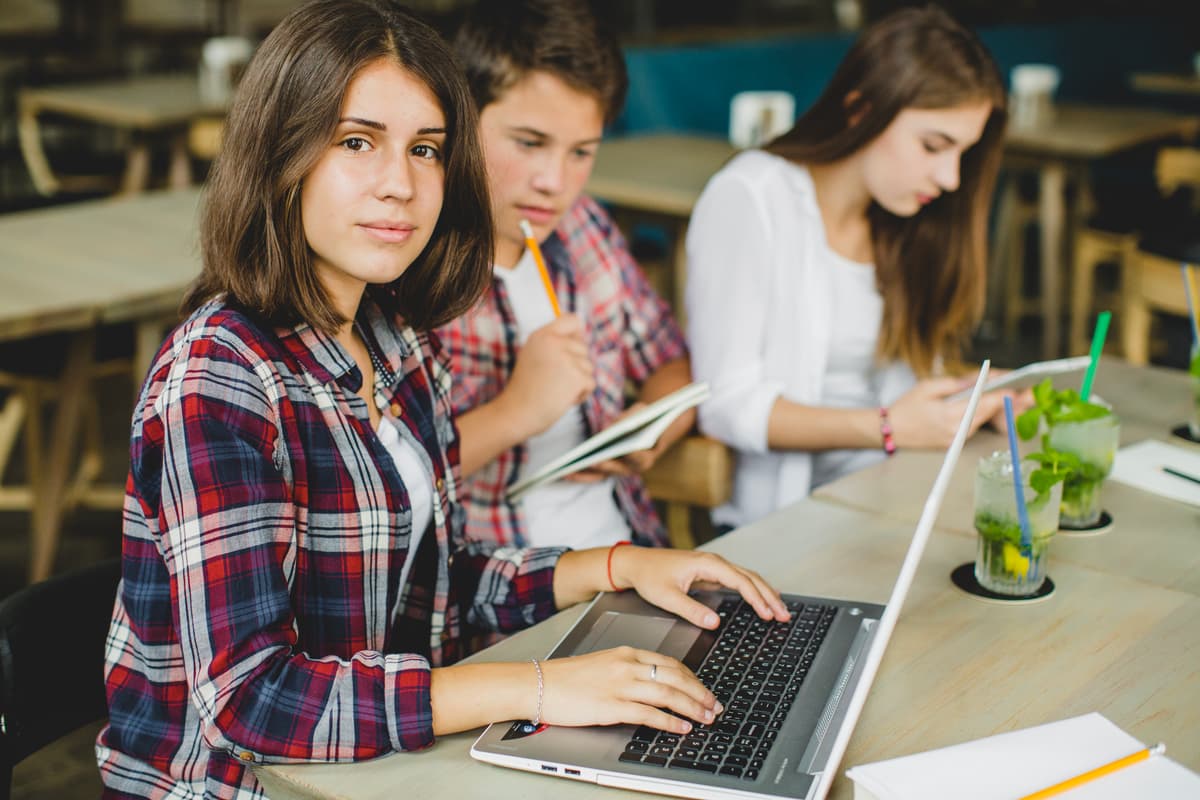 Students in plaid shirts collaborating